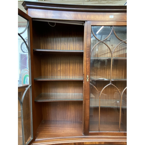 41 - A Bevan Funnell Ltd Reprodux mahogany glazed concave bookcase/display cabinet - approx. 205cm high x... 