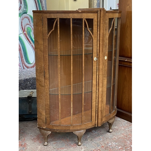 42 - An Art Deco style walnut bow fronted display cabinet - approx. 126cm high x 100cm wide x 34cm deep