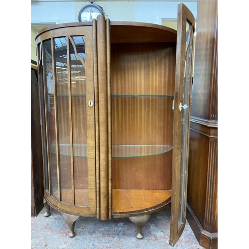 42 - An Art Deco style walnut bow fronted display cabinet - approx. 126cm high x 100cm wide x 34cm deep