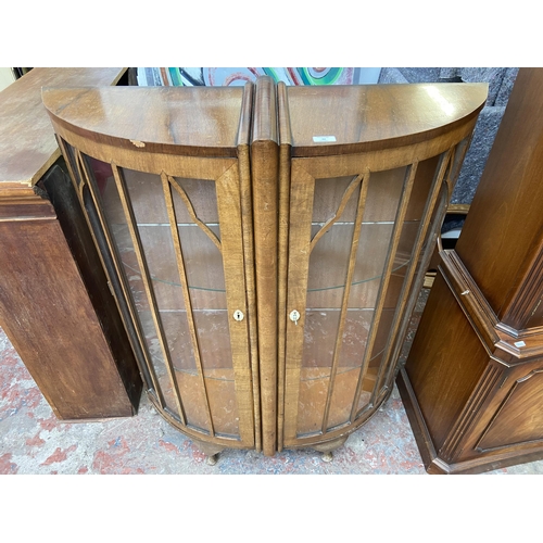 42 - An Art Deco style walnut bow fronted display cabinet - approx. 126cm high x 100cm wide x 34cm deep