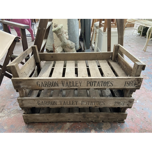 48 - Five items, three wooden twin handled stacking potato crates - approx. 17cm high x 46cm wide x 76cm ... 