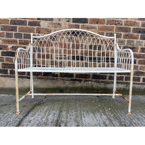 57 - A white painted wrought metal garden bench - approx. 96cm high x 114cm wide x 43cm deep