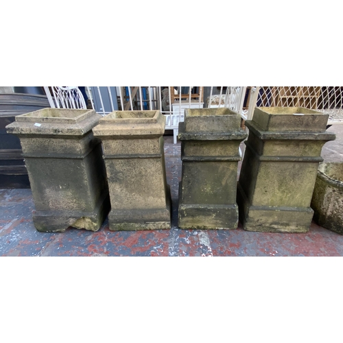 66 - Four 19th century clay chimney pots - approx. 58cm high