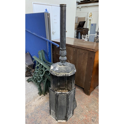 74 - A Victorian style black painted cast metal outdoor stove - approx. 170cm high