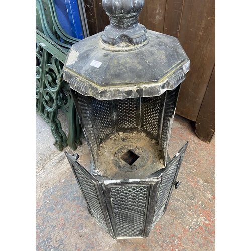 74 - A Victorian style black painted cast metal outdoor stove - approx. 170cm high