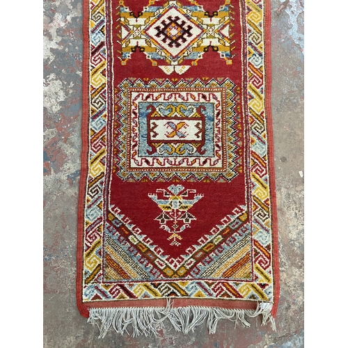 8 - A 20th century Turkish hand knotted hall runner - approx. 305cm x 76cm