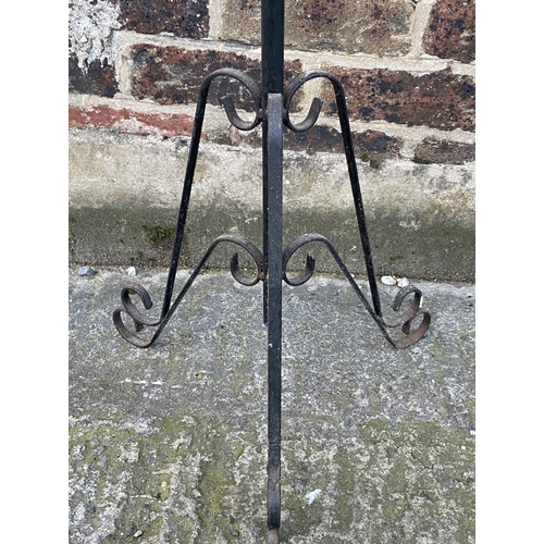 85 - A black painted wrought metal tripod pedestal plant stand - approx. 99cm high x 24cm diameter