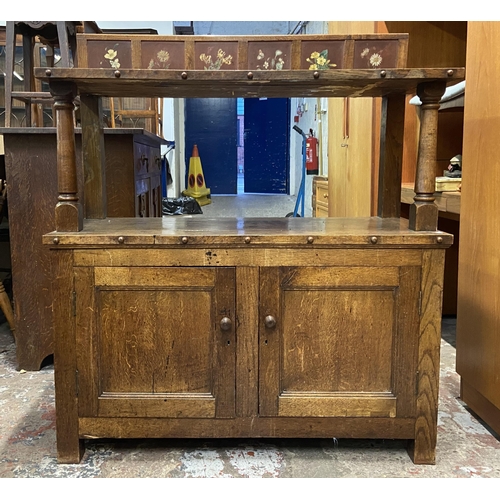 89 - A 19th century oak buffet with hand painted floral design back - approx. 126cm high x 110cm wide x 4... 