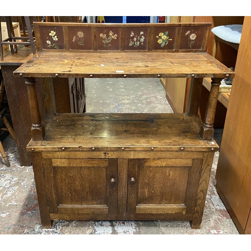 89 - A 19th century oak buffet with hand painted floral design back - approx. 126cm high x 110cm wide x 4... 