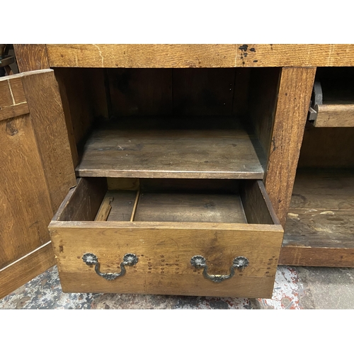 89 - A 19th century oak buffet with hand painted floral design back - approx. 126cm high x 110cm wide x 4... 