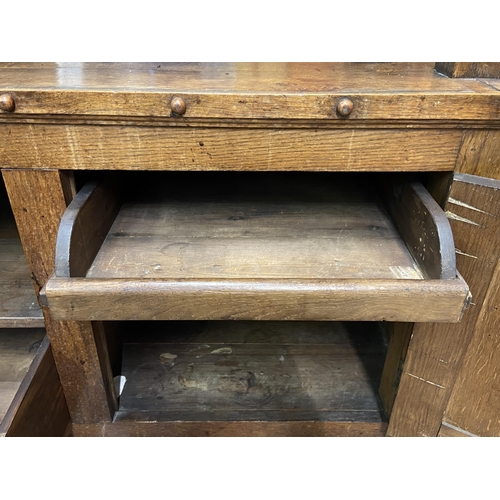 89 - A 19th century oak buffet with hand painted floral design back - approx. 126cm high x 110cm wide x 4... 