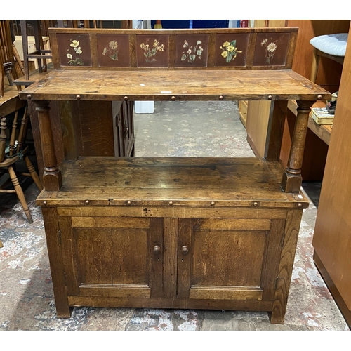 89 - A 19th century oak buffet with hand painted floral design back - approx. 126cm high x 110cm wide x 4... 