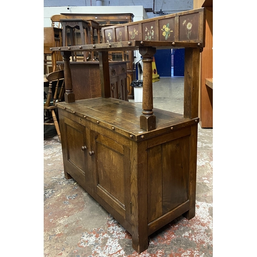 89 - A 19th century oak buffet with hand painted floral design back - approx. 126cm high x 110cm wide x 4... 