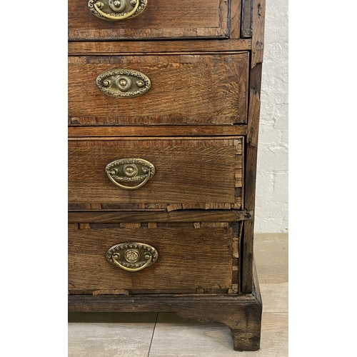 90 - A George III mahogany crossbanded and oak bureau - approx. 98cm high x 87cm wide x 46cm deep