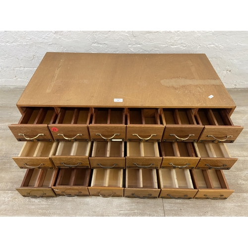 99 - Three sets of mid 20th century mahogany and plywood six drawer index filing cabinets - each approx. ... 