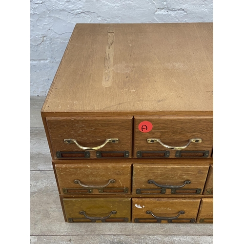 99 - Three sets of mid 20th century mahogany and plywood six drawer index filing cabinets - each approx. ... 