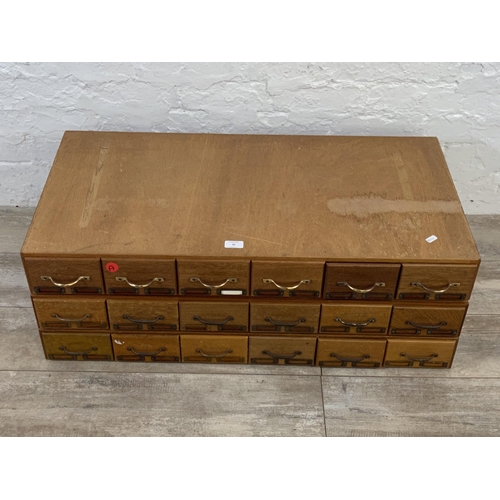 99 - Three sets of mid 20th century mahogany and plywood six drawer index filing cabinets - each approx. ... 