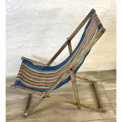 49 - Two mid 20th century beech framed sun loungers