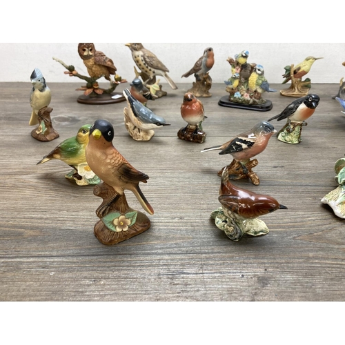 A collection of bird figurines to include Beswick, Bossons, Country ...