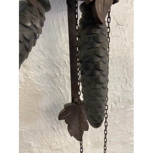 30 - A mid 20th century German carved wooden cased cuckoo clock with two weights - approx. 29cm high