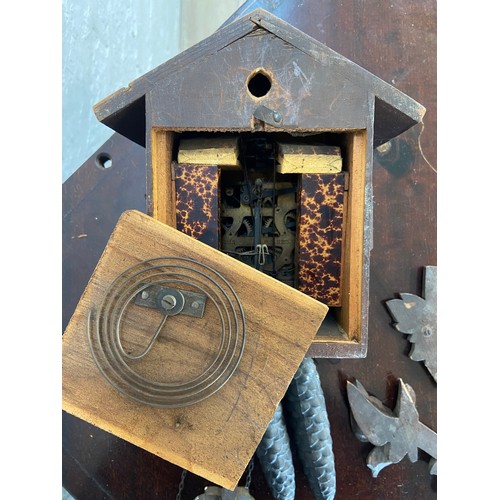 30 - A mid 20th century German carved wooden cased cuckoo clock with two weights - approx. 29cm high