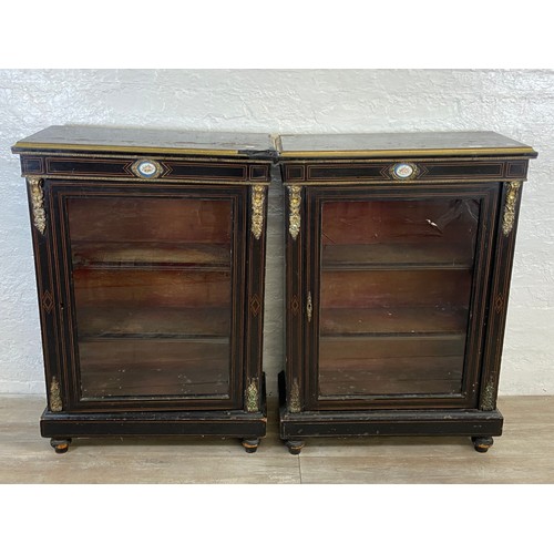 31 - A pair of 19th century ebonised and inlaid pier cabinets with gilt metal decoration and hand painted... 