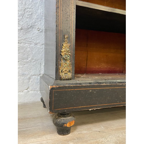 31 - A pair of 19th century ebonised and inlaid pier cabinets with gilt metal decoration and hand painted... 