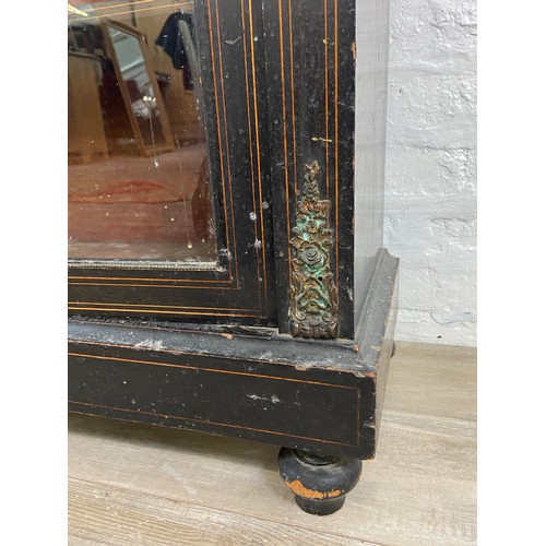 31 - A pair of 19th century ebonised and inlaid pier cabinets with gilt metal decoration and hand painted... 