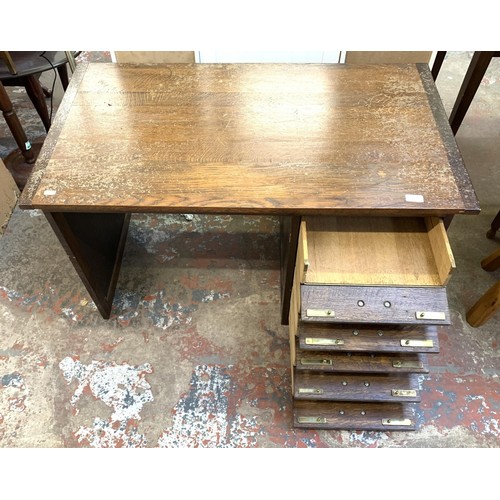 95 - A mid 20th century bespoke oak office desk with five fall front drawers - approx. 62cm high x 107cm ... 