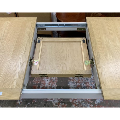 97 - An Arighi Bianchi oak and grey painted extending dining table - approx. 79cm high x 120cm long x 85c... 