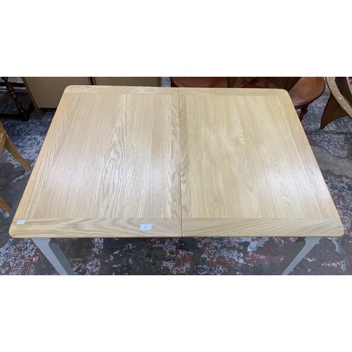 97 - An Arighi Bianchi oak and grey painted extending dining table - approx. 79cm high x 120cm long x 85c... 