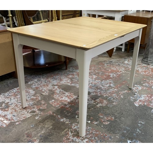 97 - An Arighi Bianchi oak and grey painted extending dining table - approx. 79cm high x 120cm long x 85c... 