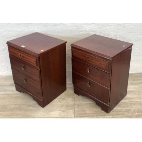 114 - A pair of 1980s mahogany bedside chests of three drawers - approx. 67cm high x 51cm wide x 42cm deep