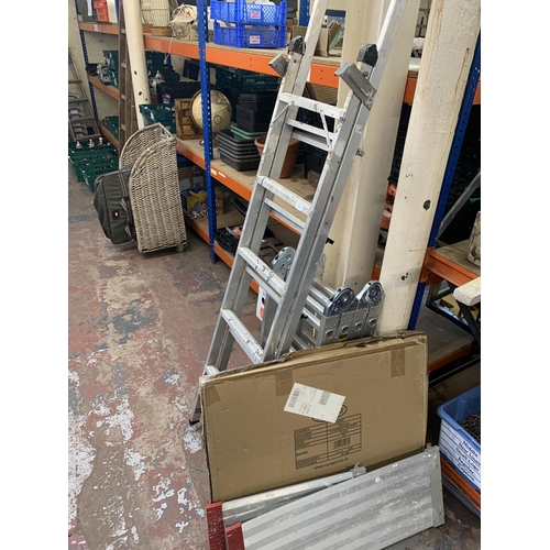 1040 - Two pairs of aluminium ladders, one step and one work platform together with a boxed fire guard