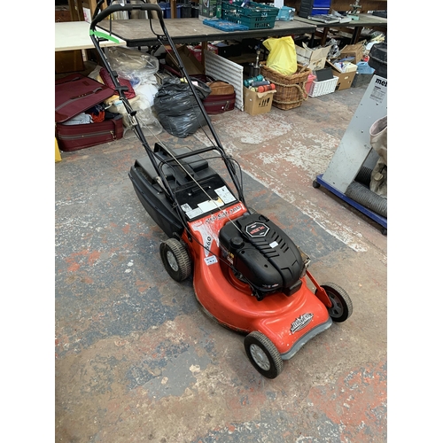 1065 - A Rover Pro Cut 560 self petrol lawn mower with Briggs & Stratton engine