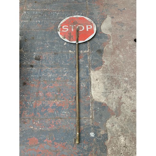 1067A - A wood and metal stop and go sign - approx. 183cm long