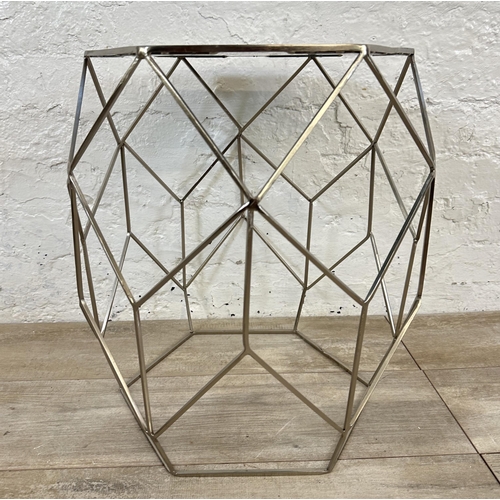 10 - A contemporary black glass and metal hexagonal side table - approx. 51cm high x 41 cm wide x 35cm de... 