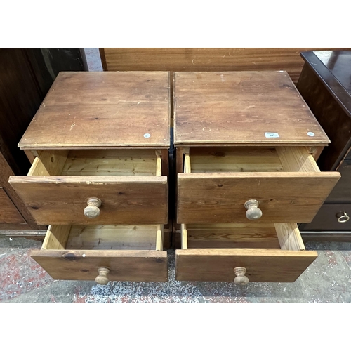 102 - A pair of modern solid pine bedside chests of drawers - approx. 63cm high x 45cm wide x 47cm deep