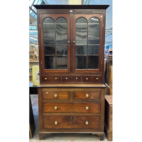 103 - An early 19th century Welsh mahogany and oak bookcase - approx. 215cm high x 110cm wide x 47cm deep