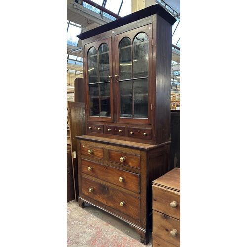 103 - An early 19th century Welsh mahogany and oak bookcase - approx. 215cm high x 110cm wide x 47cm deep