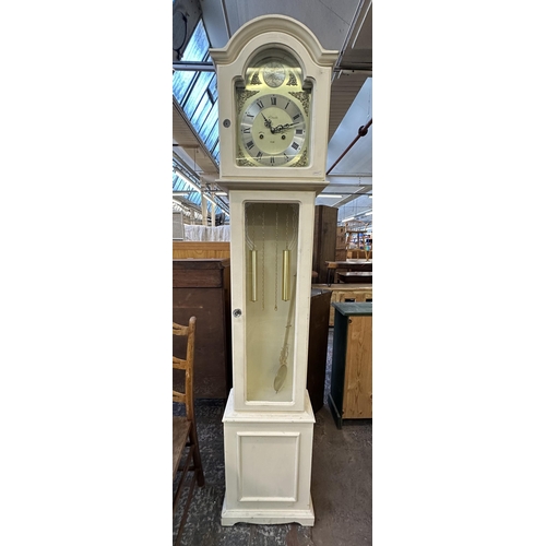 107 - Seven items to include Lincoln 31 Day white painted cased grandmother clock, bamboo and wicker side ... 