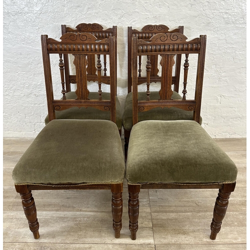 109 - Four Edwardian carved oak and green fabric upholstered dining chairs