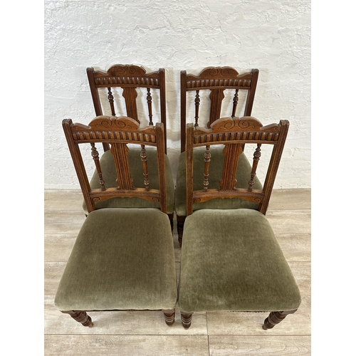 109 - Four Edwardian carved oak and green fabric upholstered dining chairs