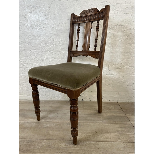 109 - Four Edwardian carved oak and green fabric upholstered dining chairs