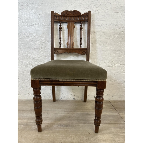 109 - Four Edwardian carved oak and green fabric upholstered dining chairs