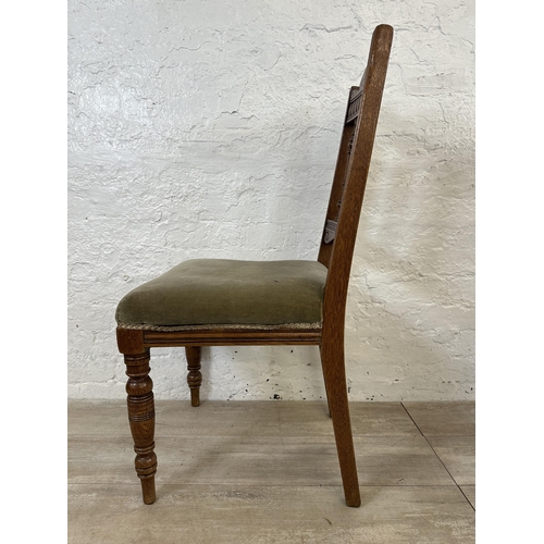 109 - Four Edwardian carved oak and green fabric upholstered dining chairs