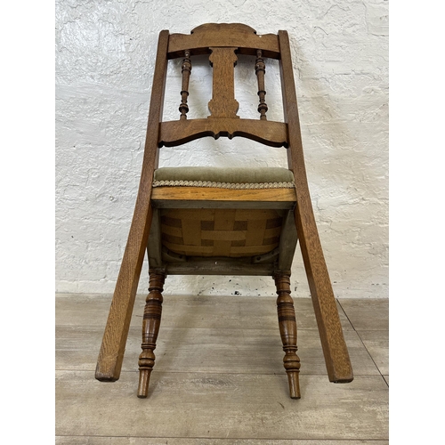 109 - Four Edwardian carved oak and green fabric upholstered dining chairs