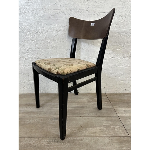 110 - Four mid 20th century teak and ebonised dining chairs with floral fabric upholstery