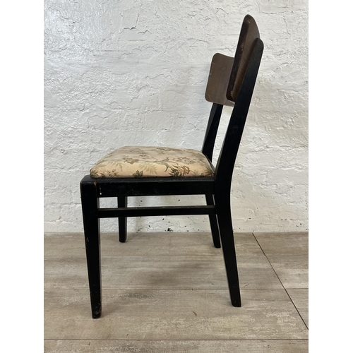 110 - Four mid 20th century teak and ebonised dining chairs with floral fabric upholstery