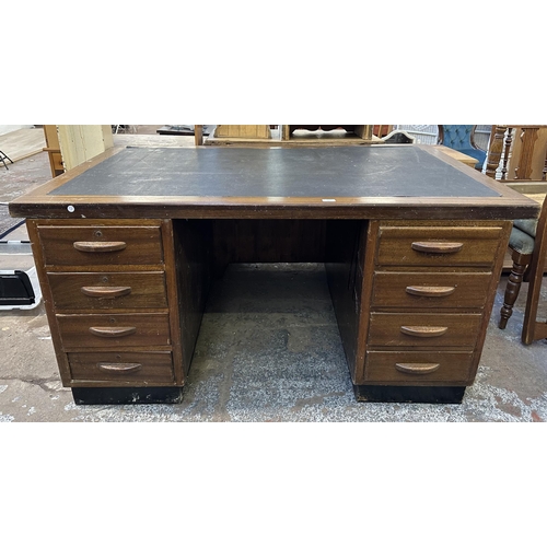 111 - A mid 20th century Partridge & Cooper (O.E.) Ltd mahogany pedestal desk - approx. 77cm high x 152cm ... 